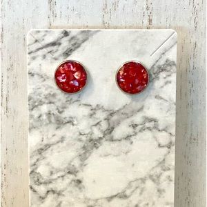 112. Red crushed shell studs